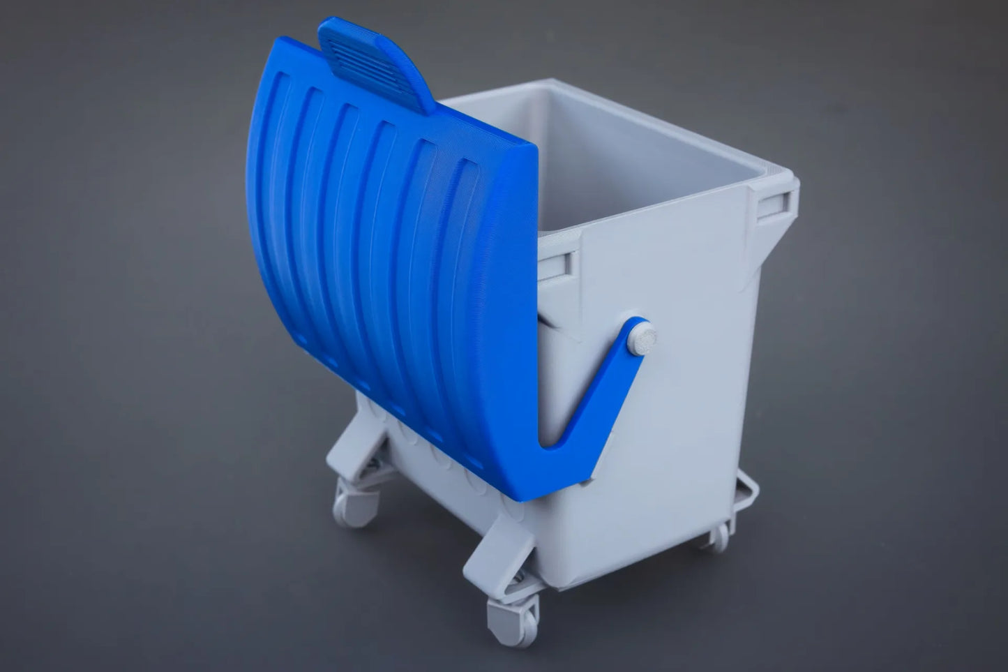 The swing-top dumpster desktop bin
