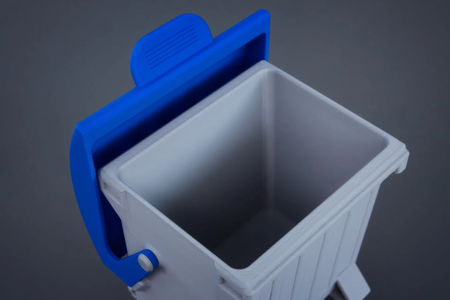 The swing-top dumpster desktop bin